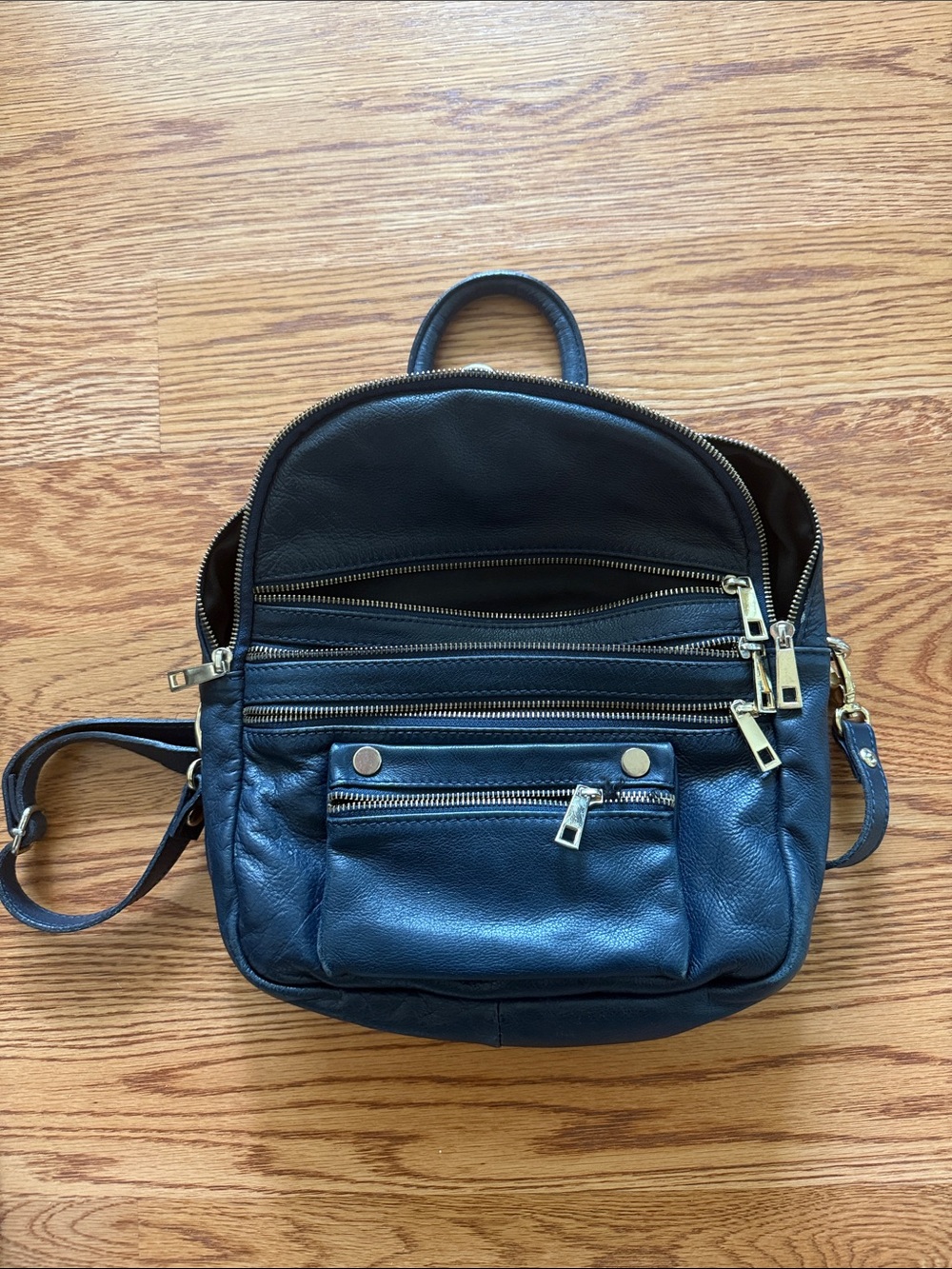 Compact Navy Leather Backpack with Multiple Zippers